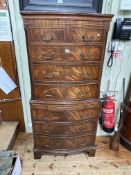 Mahogany serpentine front tallboy chest of two short above six long drawers and brush slide, 153.