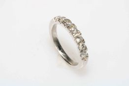 18 carat white gold seven stone diamond half eternity ring, size O.