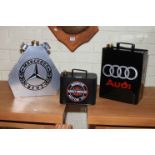 Three advert fuel cans, Mercedes Benz, Harley Davidson and Audi.