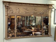 Antique gilt framed overmantel with triple bevelled mirror panels, 91cm by 143cm.