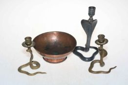 Three cobra candlesticks and copper bowl (4).