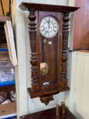 Victorian walnut cased double weight wall clock having enamelled dial.
