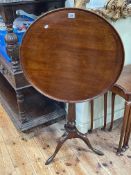 Antique circular mahogany snap top occasional table on reeded pedestal tripod base,
