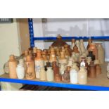 Large collection of vintage stoneware bottles.