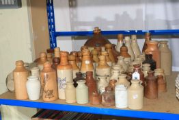 Large collection of vintage stoneware bottles.