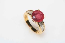 18 carat yellow gold ruby and diamond ring, the central circular 3.