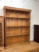 Pine four tier open bookcase, 108cm by 82cm by 21cm.