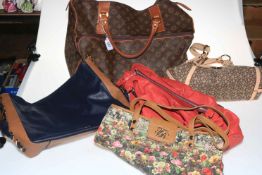 Five designer handbags.
