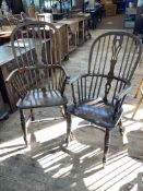 Two antique Windsor pierced splat back elbow chairs, one with crinoline stretcher.