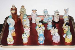 Collection of twenty one Royal Worcester figure candle snuffers.