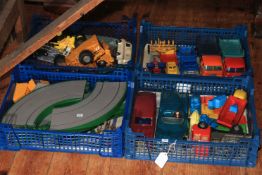Four boxes of vintage toy vehicles.