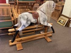Cookham Dean Relko large dapple grey rocking horse on safety stand, 125cm by 147cm.