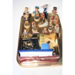 Twelve Hummel figures and two small dishes, costume jewellery and watches.
