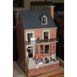 Dolls house with accessories, 105cm high by 52cm length, by 67cm deep.