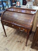 Edwardian mahogany cylinder desk having single drawer raised on square tapering legs,