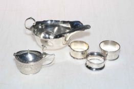 Silver sauce boat with silver serving spoon, silver lidded mustard pot,