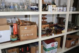 Full shelf of collectables including chess pieces and boards, metalware,