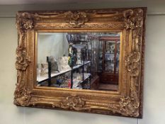 Rectangular substantial gilt framed bevelled wall mirror, 115cm by 89cm including frame.