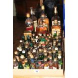 Seven bottles of whisky and approximately eighty miniatures including Teacher's 75cl, Bell's 75cl,