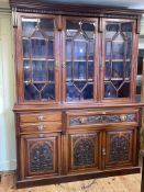 Victorian carved walnut library secretaire bookcase having three astragal glazed doors above a