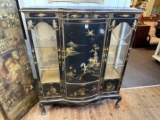 Black lacquered chinoiserie cabinet having bow front central door flanked by two glazed panels on
