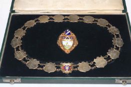 Cased Masonic gold and enamel jewel with silver chain,