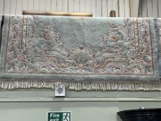 Pale green and floral patterned Chinese carpet 3.20 by 2.10.
