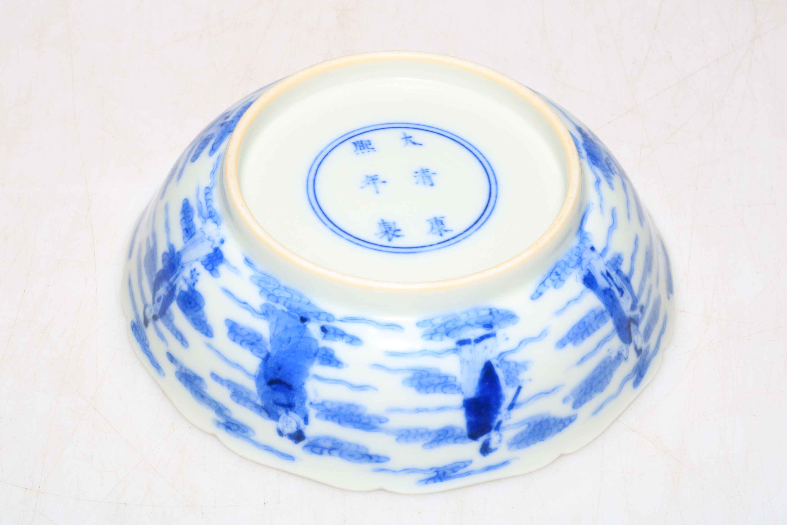 Blue and white Chinese shallow dish decorated with a series of figures, Kangxhi mark to base, - Image 3 of 3