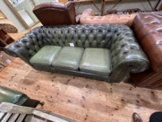 Green buttoned leather three seater Chesterfield settee.