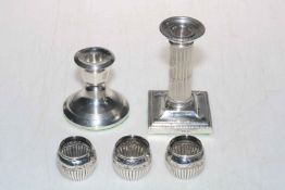 Two loaded silver candlesticks and set of three Victorian silver salts, London 1888.