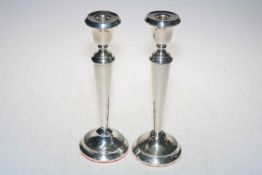 Pair of large loaded silver candlesticks, 29cm high, marks worn.