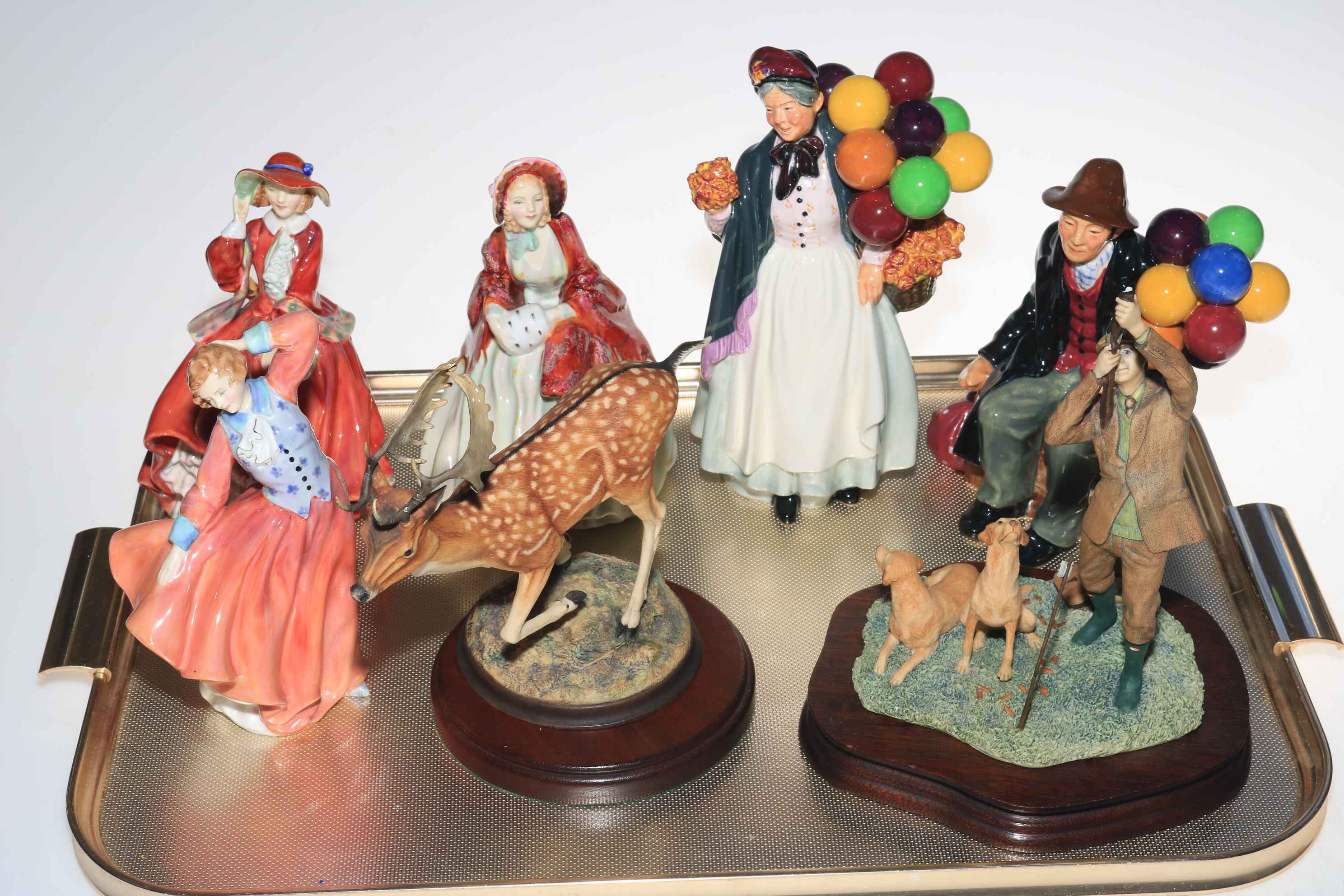 Five Royal Doulton figures including The Balloon Man and Biddy Penny Farthing and two Border Fine