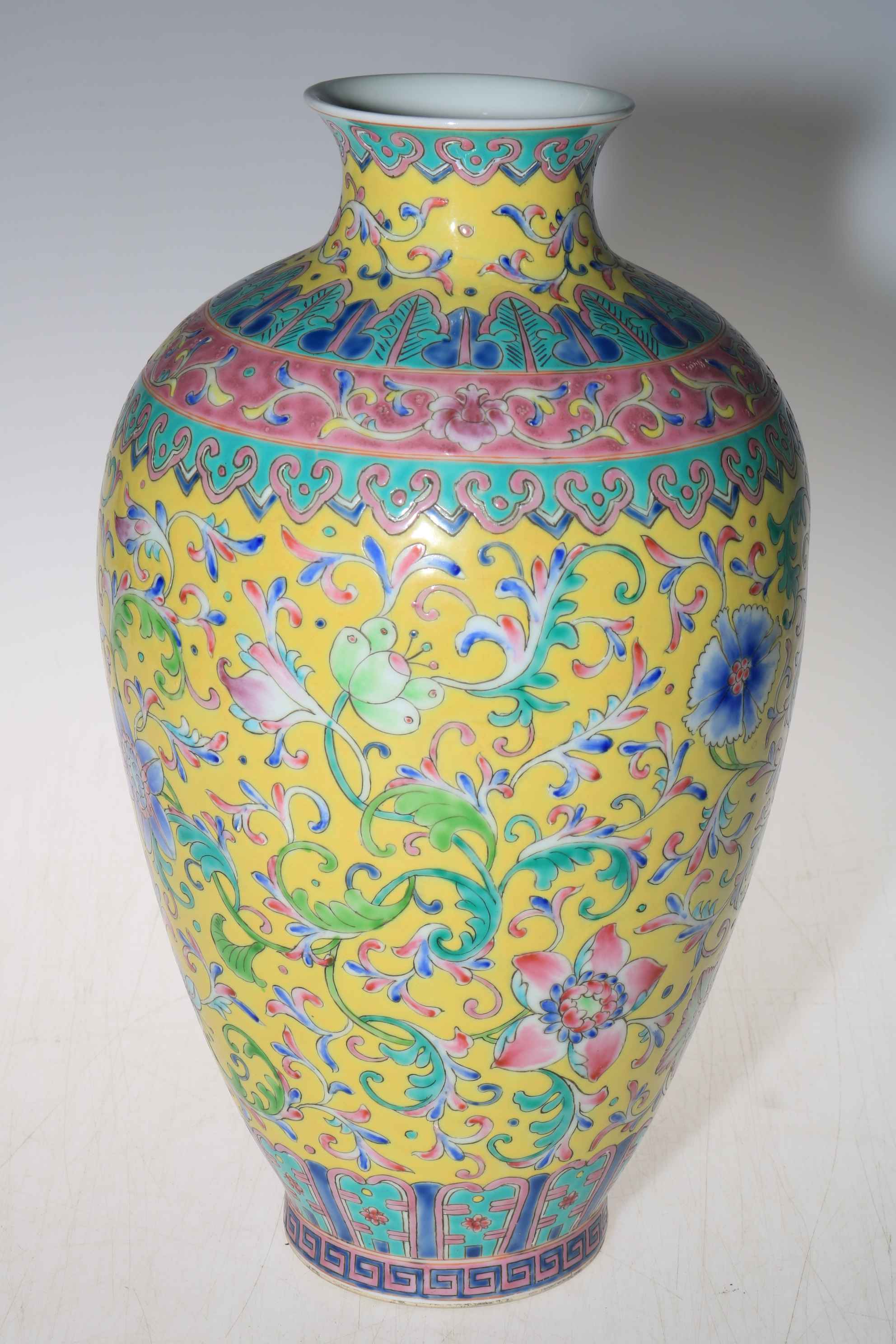 Large Chinese yellow ground vase with floral design with Qianlong mark to base, 33.5cm high.