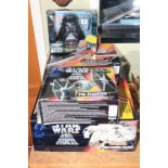 Four Star Wars boxed toys including X-Wing Fighter, Millennium Falcon,