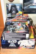 Four Star Wars boxed toys including X-Wing Fighter, Millennium Falcon,