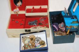 Three boxes of assorted costume jewellery.