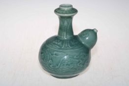 Chinese Celadon vase/vessel decorated with raised dragon.