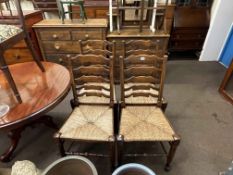 Set of four Country style oak ladder back and rush seated dining chairs,