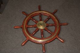 Mahogany and brass ships wheel, 87cm high.