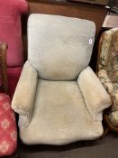 Victorian easy chair on turned legs.