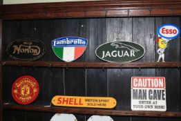Seven cast iron signs.
