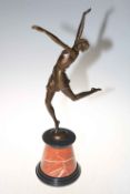 Art Deco style bronze of dancing lady on marble plinth, 65cm high.