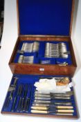 Oak cutlery box containing a selection of mainly Kings pattern cutlery.