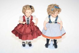 Two Shirley Temple dolls with boxes.