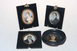 Four ebonised framed portrait miniatures.