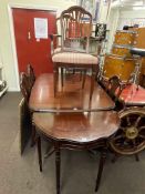 Mahogany twin pedestal extending dining table and six chairs including pair carvers and demi lune