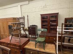 Stained pine two door glazed bookcase, four bar towel rail and child's chair,