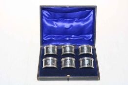 Cased set of six silver serviette rings, Birmingham 1912 by John Sherwood & Sons.