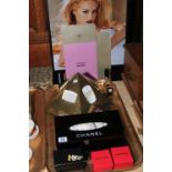 Chanel picture, perfume display, tissue box, Karl Lagerfeld t-shirt, Butler & Wilson teddy,