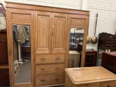 Edwardian mahogany and line inlaid combination wardrobe having two central cupboard doors above